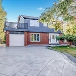 Stunning 7 Bedroom Rougeview Home With 2 Kitchens, 5 Bathrooms, Amazing Backyard & 8-Car Parking