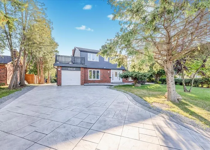 Stunning 7 Bedroom Rougeview Home With 2 Kitchens, 5 Bathrooms, Amazing Backyard & 8-Car Parking
